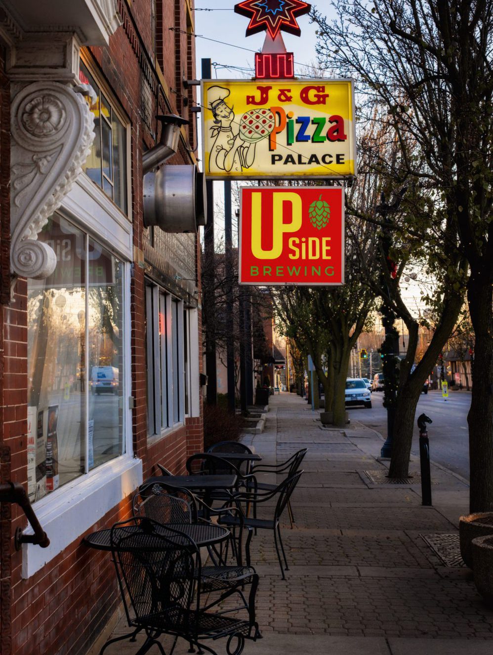 J&G Pizza and Upside Brewing sign at evening time